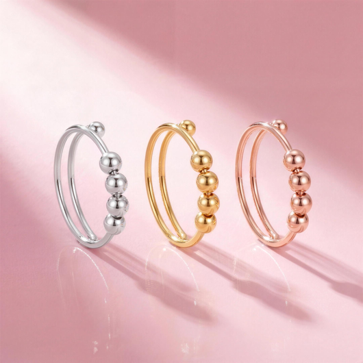 Drei Fidget Beads Ringe stehend in Silber, Gold und Roségold